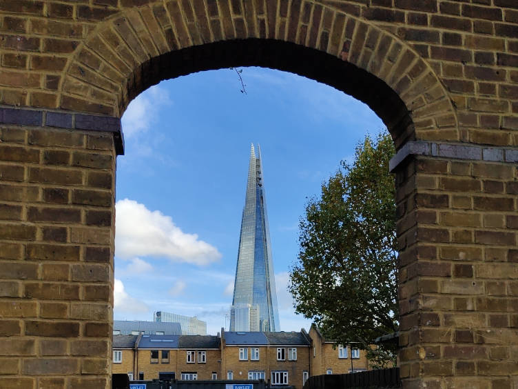 Photo: the shard through a brick archway